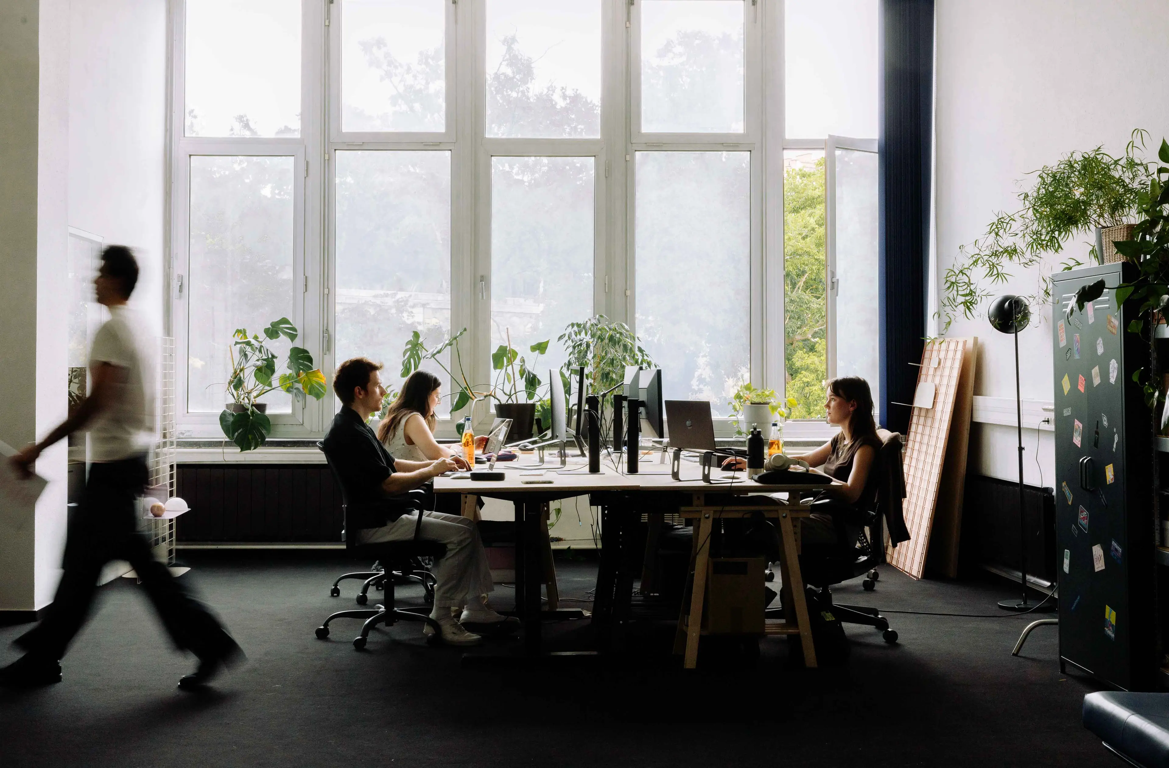 A bright creative studio with a team working together